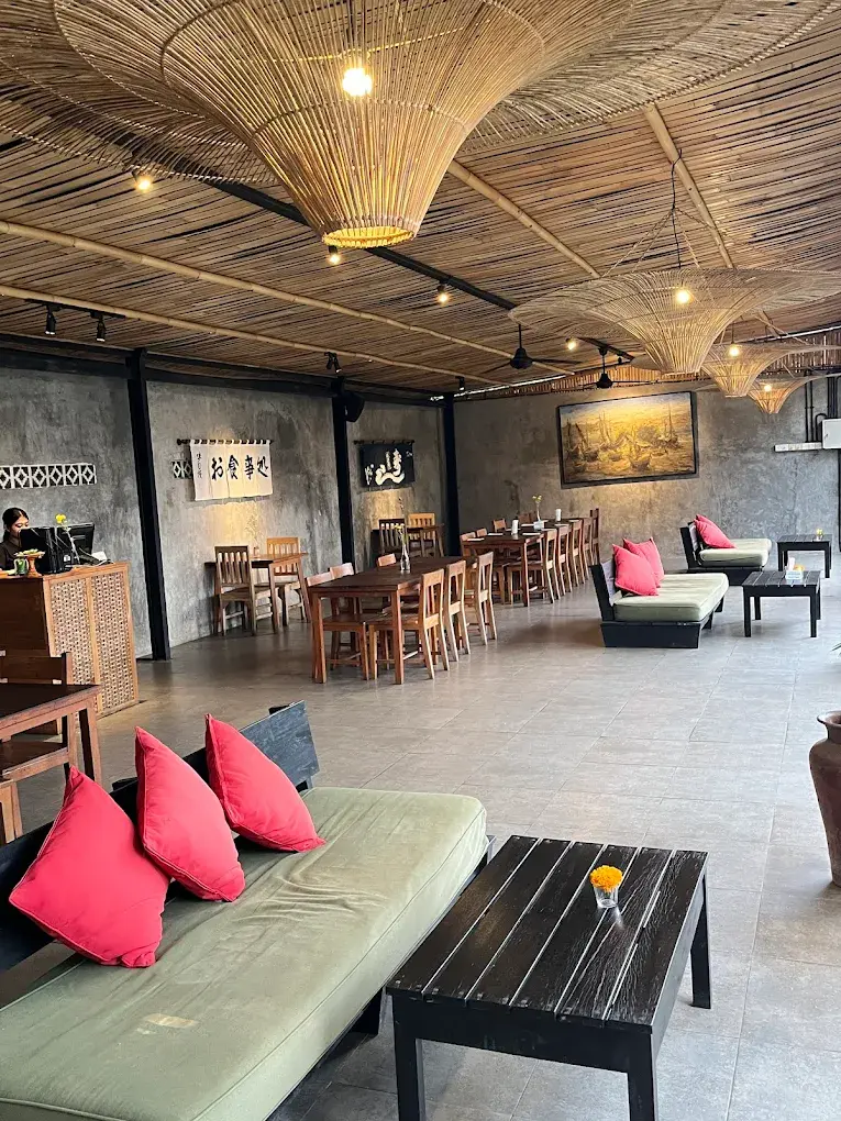 Nagi Kitchen side terrace dining area with lush Ubud greenery